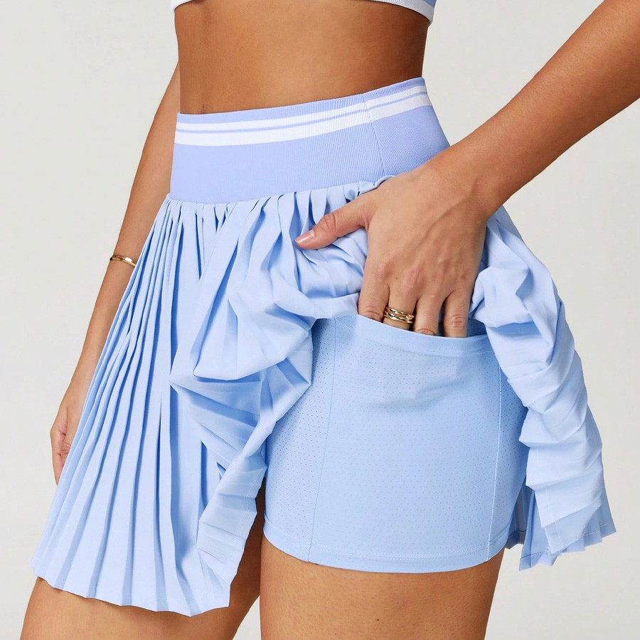 Tennis skort with inverted ball pocket and phone pocket detail