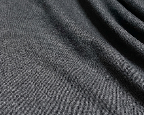 Moisture-wicking premium merino wool fabric texture for sustainable performance outerwear and activewear manufacturing.