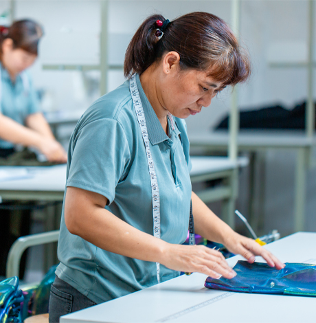 Strict inline quality control (QC) inspection process for premium yoga wear and sportswear garments.