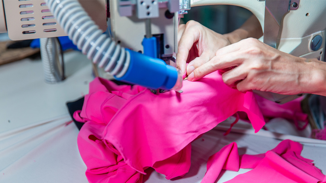 Premium 4-needle 6-thread flatlock stitching process at Call The Style factory