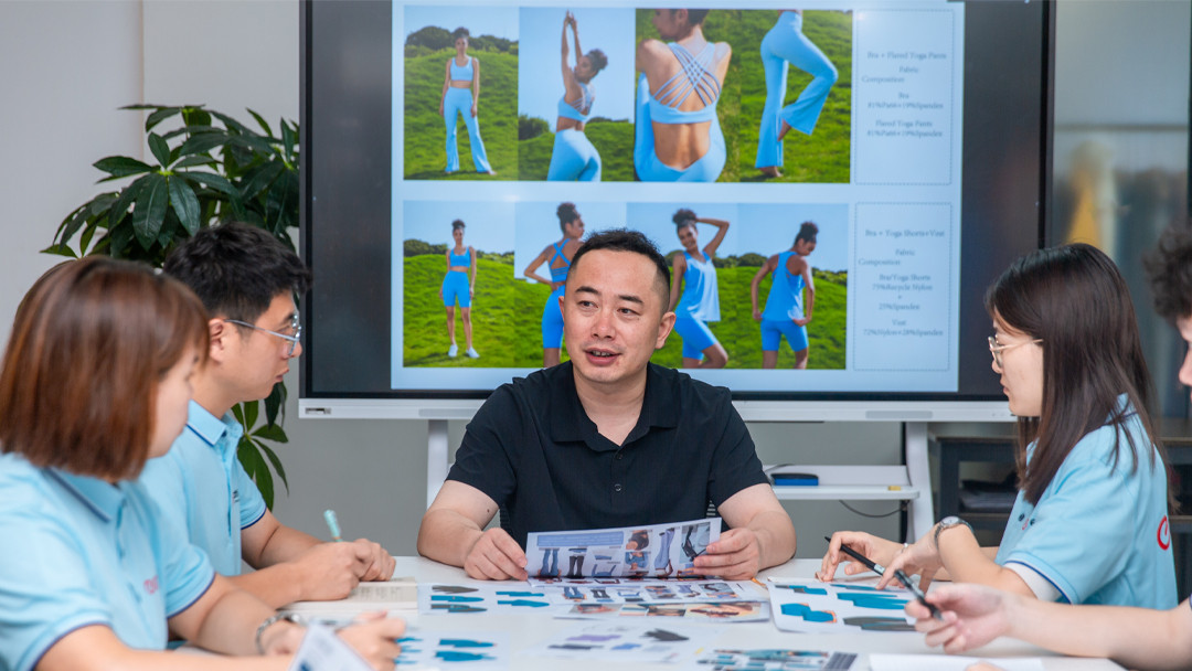 Business consultation at Call The Style factory discussing ROI and supply chain strategy for activewear brands