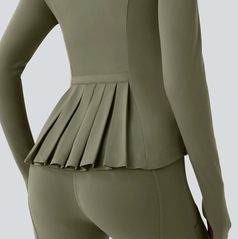 Rear view highlighting the architectural pleated peplum hem on an olive green yoga jacket, custom manufactured by a private label activewear factory.