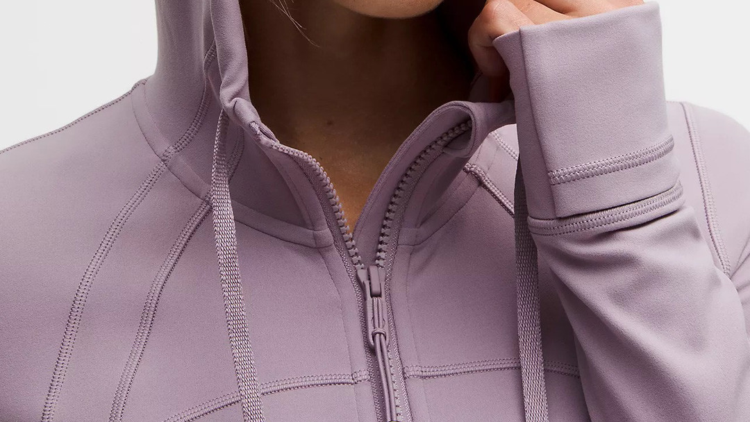 Mauve active jacket collar detail showing zipper garage and straight zipper installation