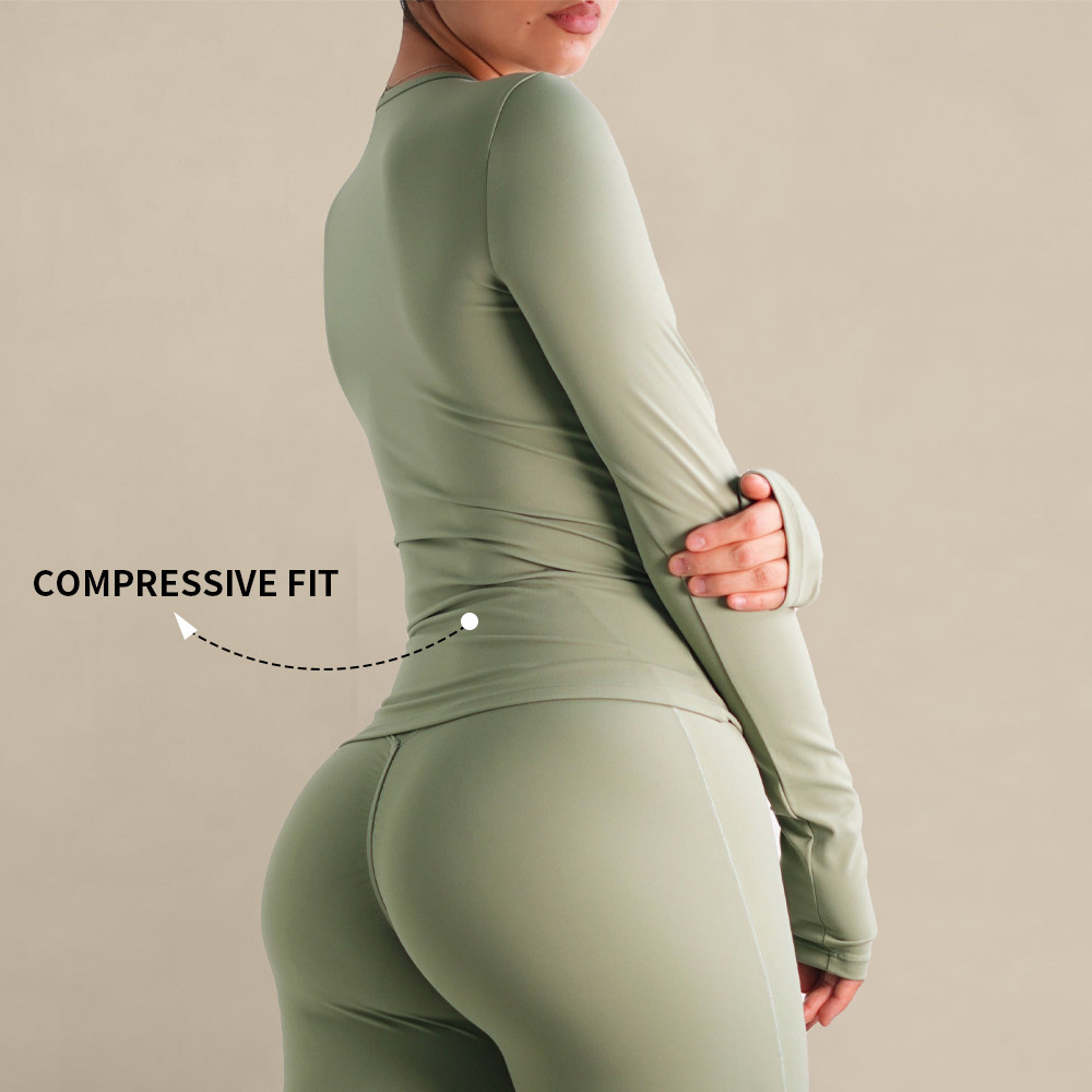 Side profile pointing out the compressive fit and waist contour on a custom workout shirt.