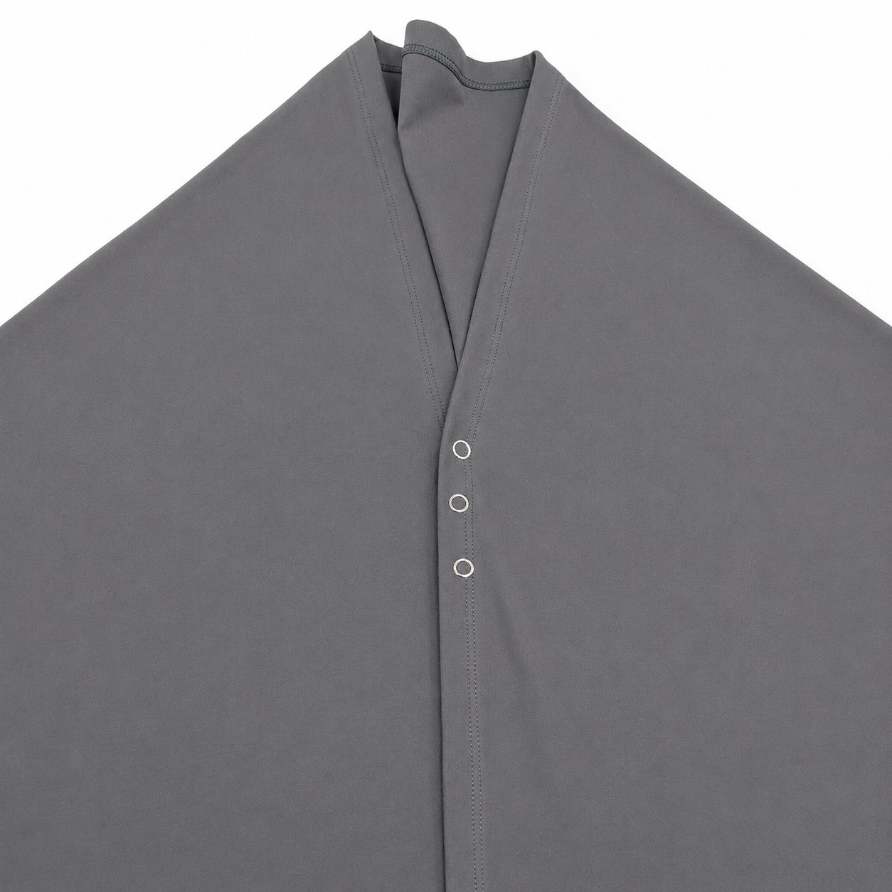 Detailed shot of the three snap buttons on the skirt overlay of womens flare leggings.