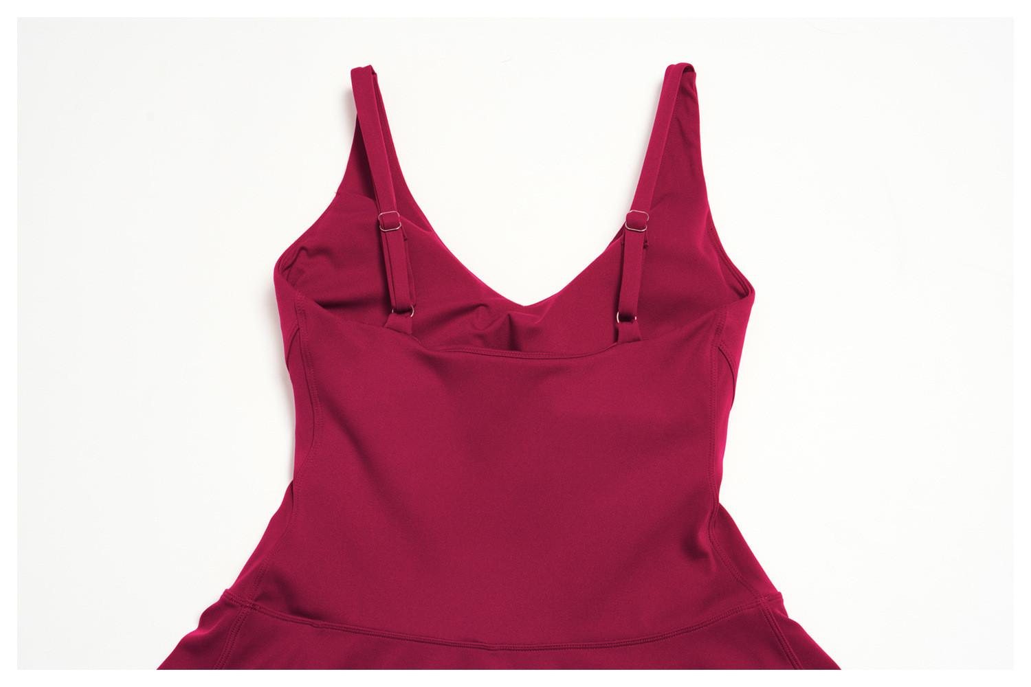 Rear view showing the adjustable spaghetti straps and v-neck back design of a custom active dress.