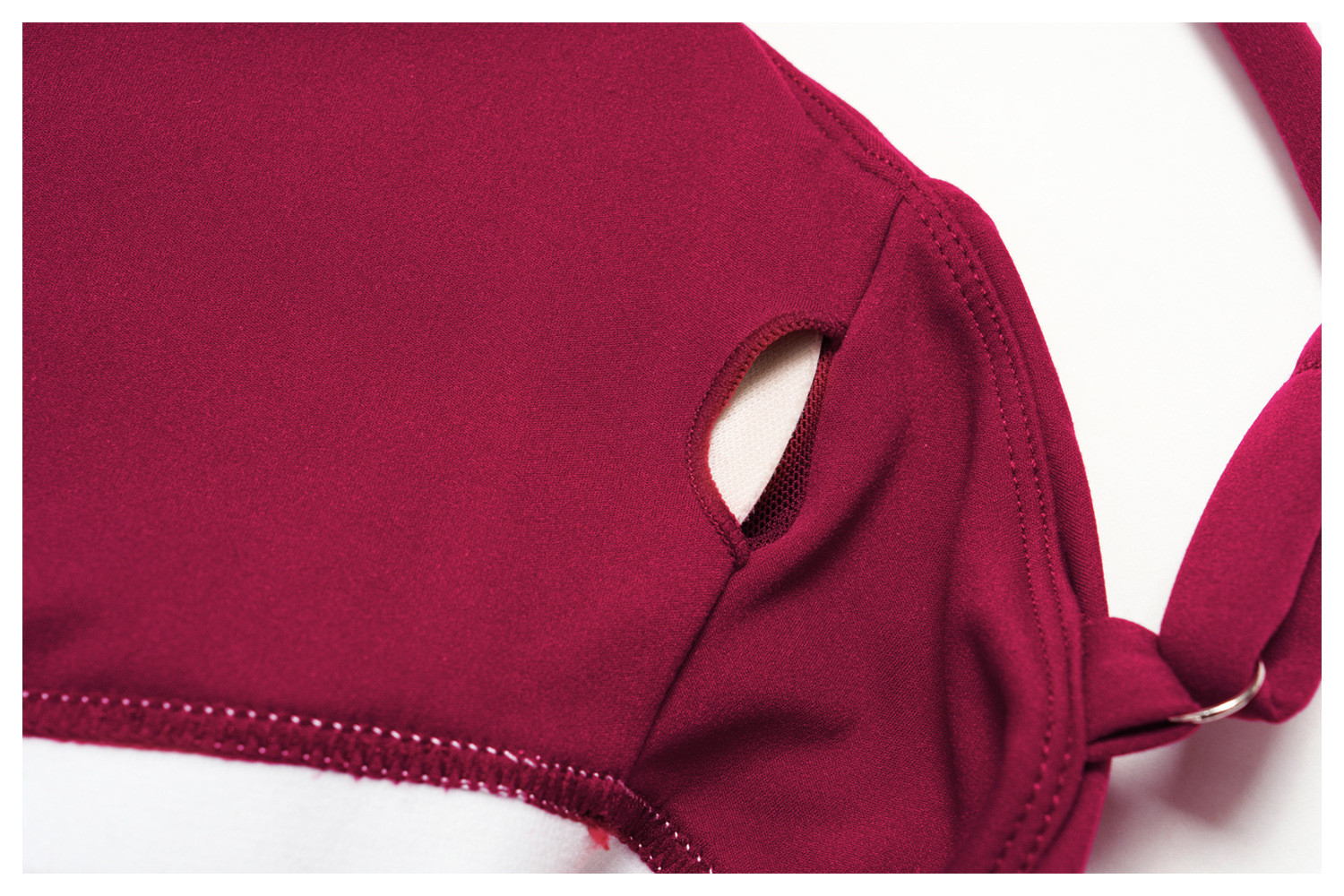 Close-up of the inner lining slit for removable pads on an active dress.