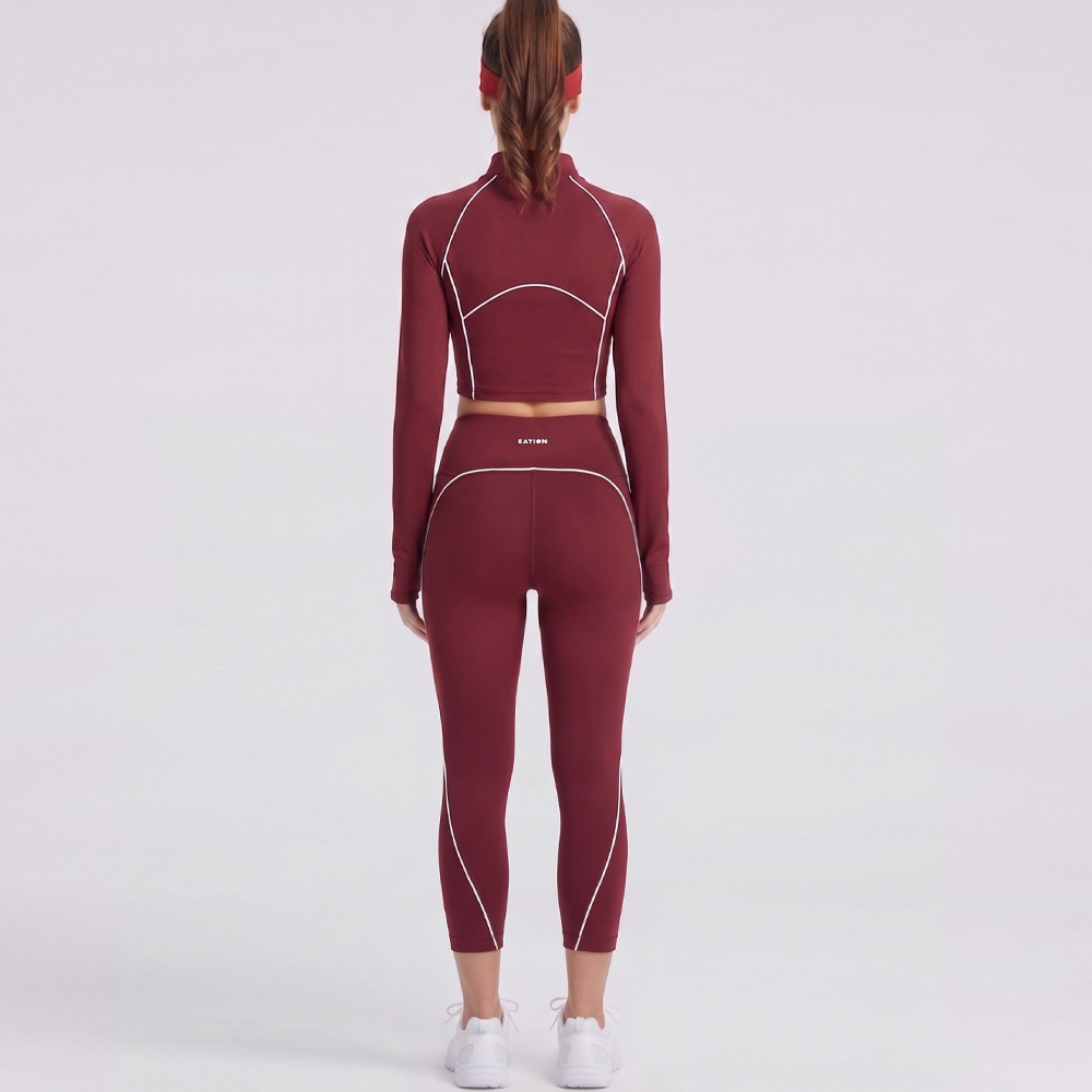 Rear view showing the tailored fit and contrast piping on a custom workout set.