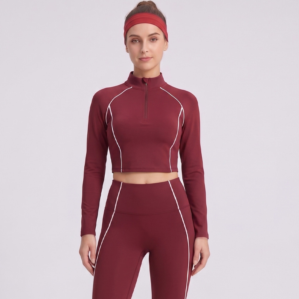 Front view demonstrating the mock neck and half zip closure on a womens yoga set.