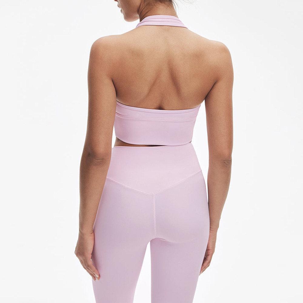Rear view showing the open back halter neck and v-waist design on custom yoga leggings.
