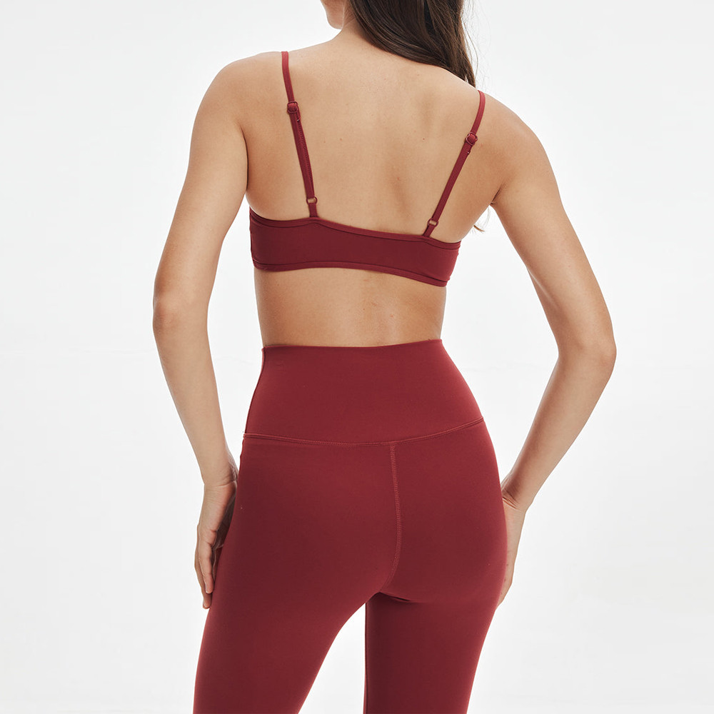 Rear view highlighting the back strap design and glute contouring of a minimalist 2-piece workout set.