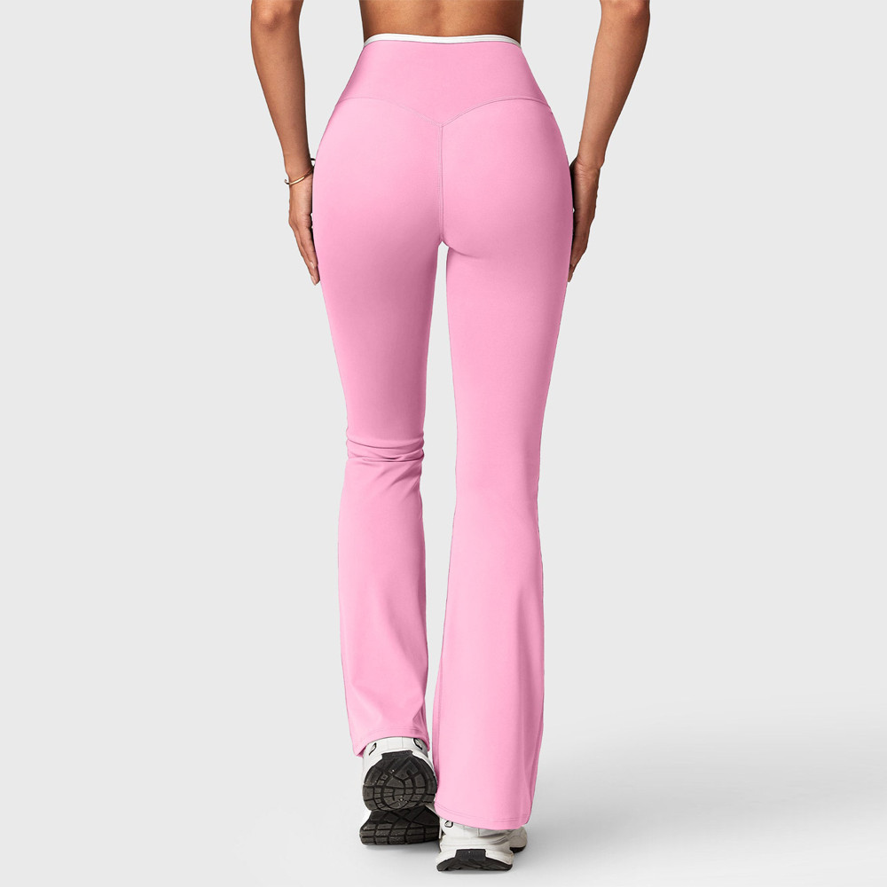Rear profile showing the clean glute panel stitching and flared calf-to-hem cut of pink activewear leggings.