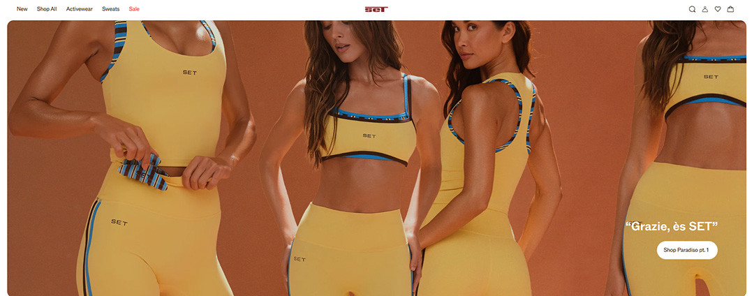 Model showcasing a yellow activewear matching set with black and blue contrast piping on an e-commerce website banner.