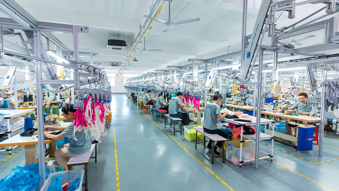 Custom activewear sewing production line inside a garment factory in Dongguan China