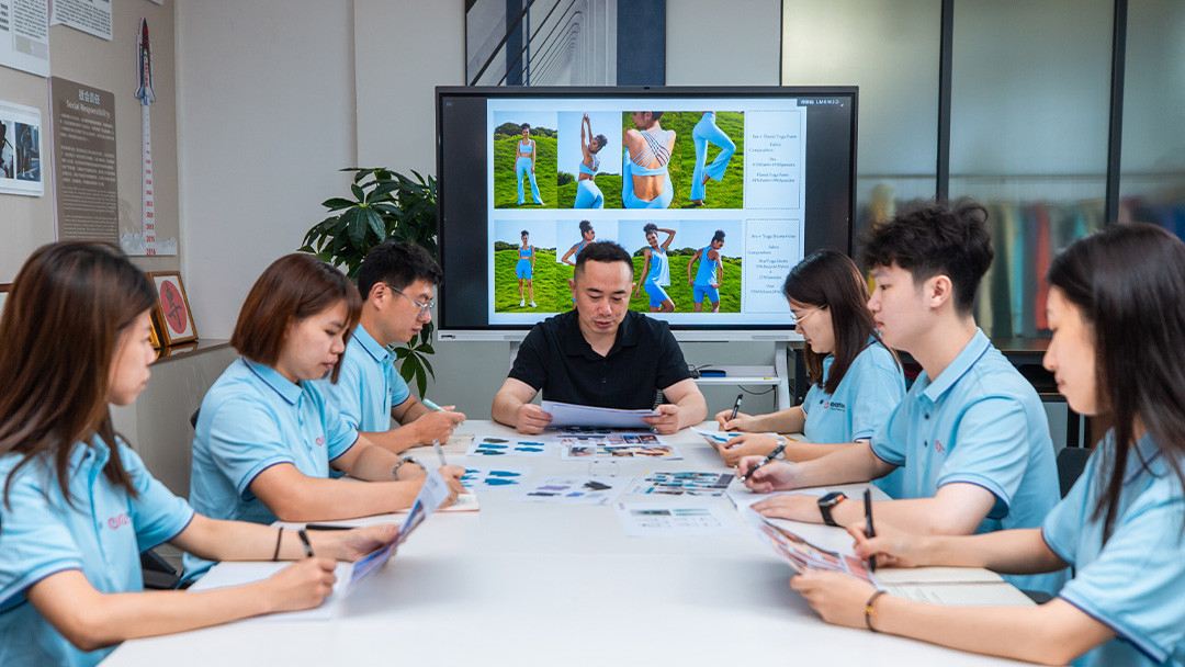 Activewear product development team reviewing sportswear designs and color options