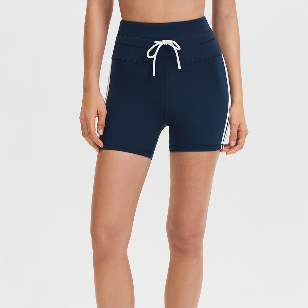 Front view of navy 4 inch yoga shorts with drawstring and white side stripes