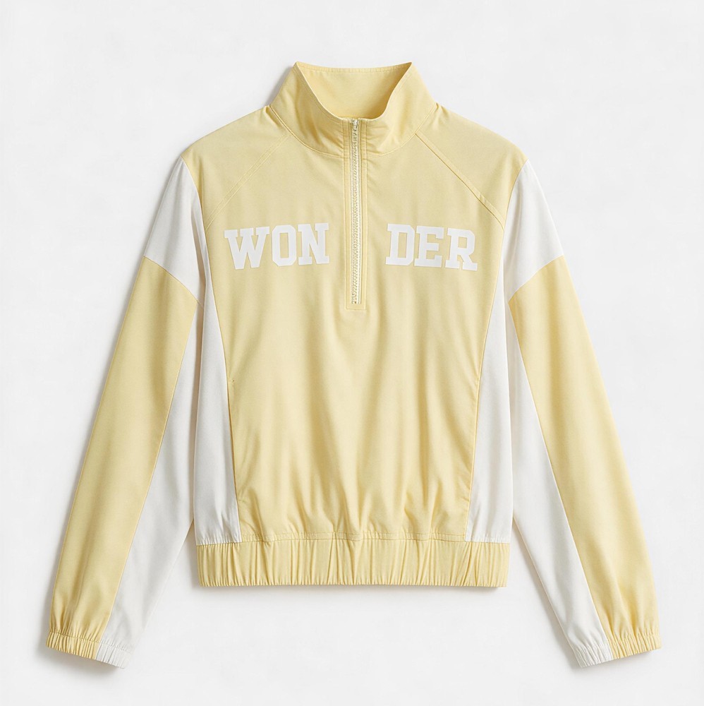 Flat lay front view of the woven twill half zip color block sweatshirt showing WON DER print and gathered hem