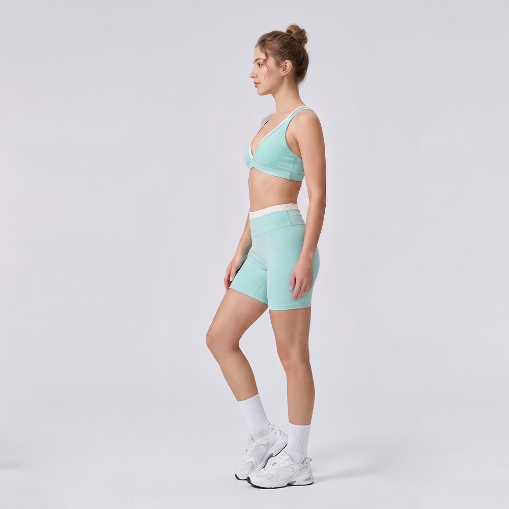 Side view of contrast yoga bra and shorts set