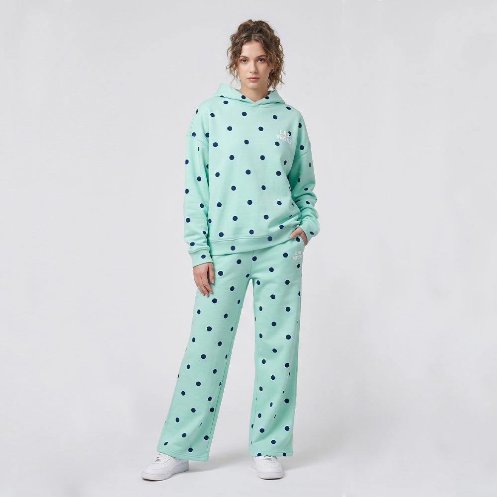 Front view of women's polka dot cotton hoodie and wide-leg pants tracksuit