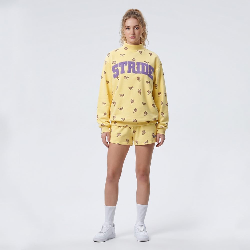 Front view of women's high-neck embroidered floral print sweatshirt and shorts set