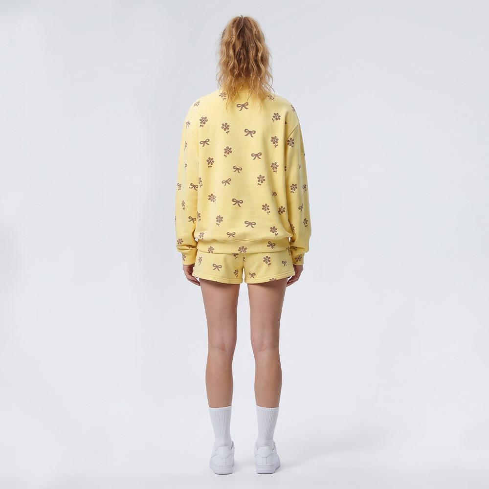 Back view of women's floral print sweatshirt and shorts set