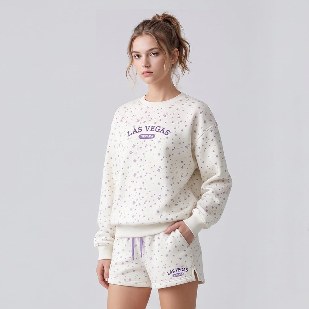 Front view of custom snowflake print crewneck sweatshirt and side-slit shorts set