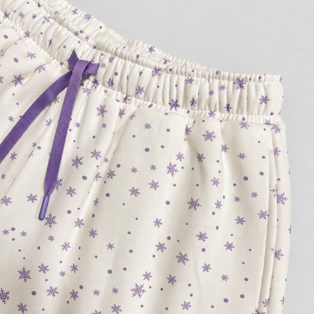Close view of drawstring waist on printed shorts