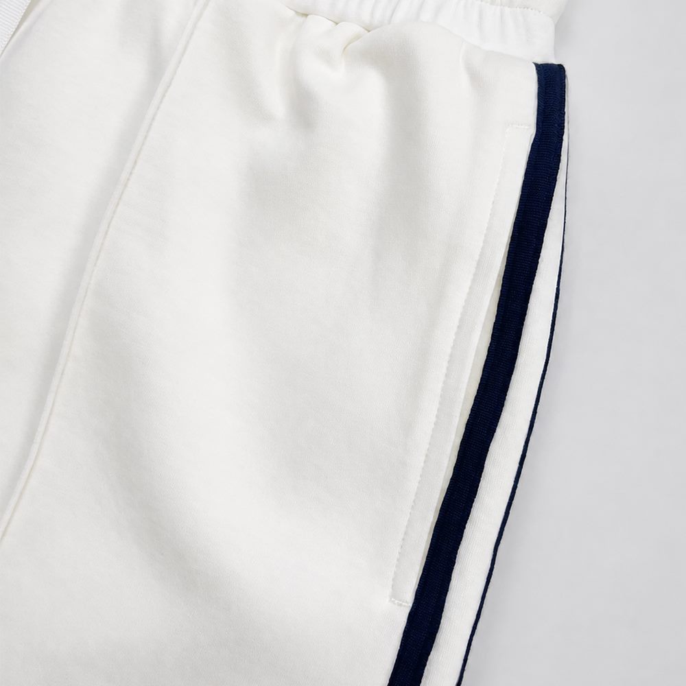 Close view of side insert pocket and contrast webbing on shorts