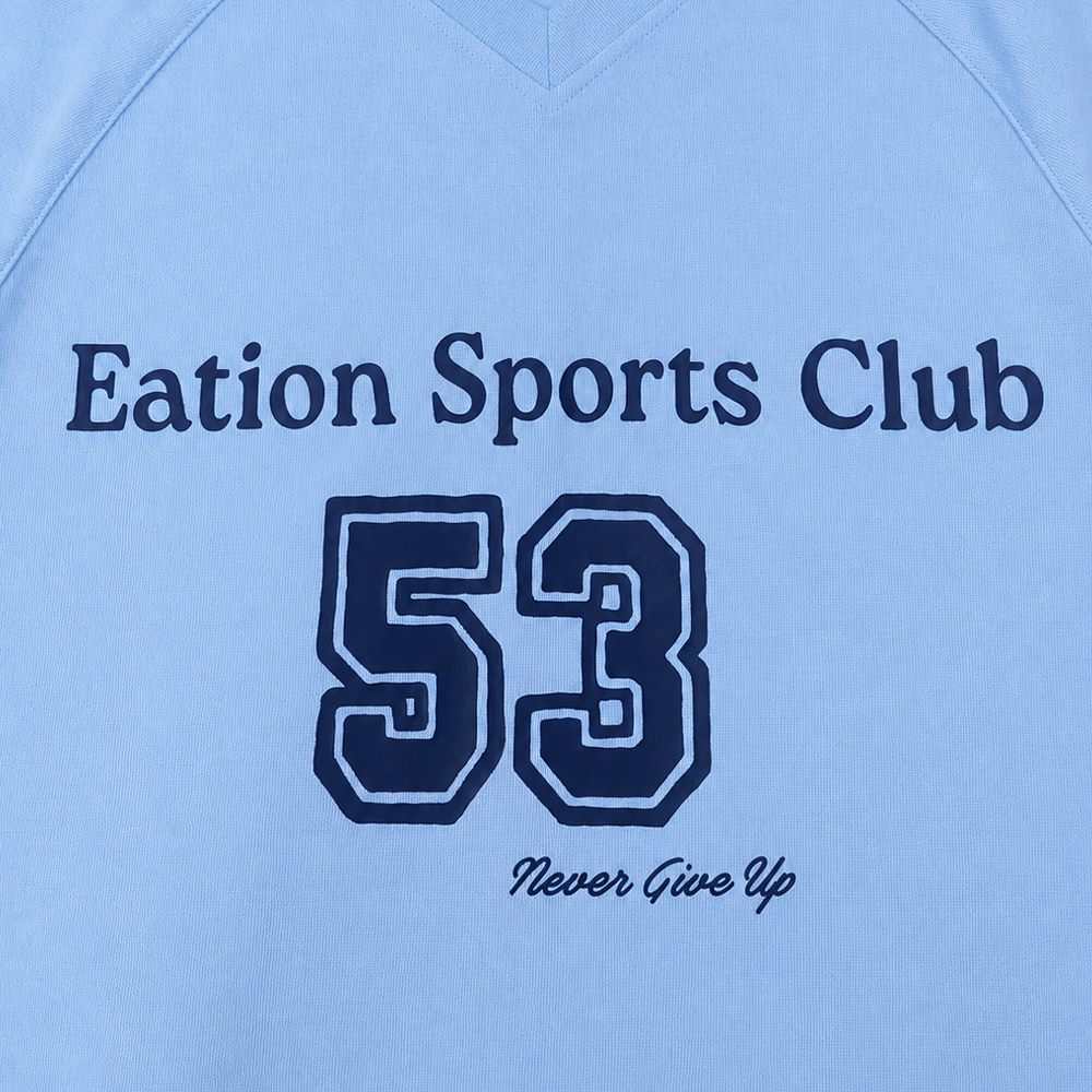 Close view of V-neck and front-center sample letter print