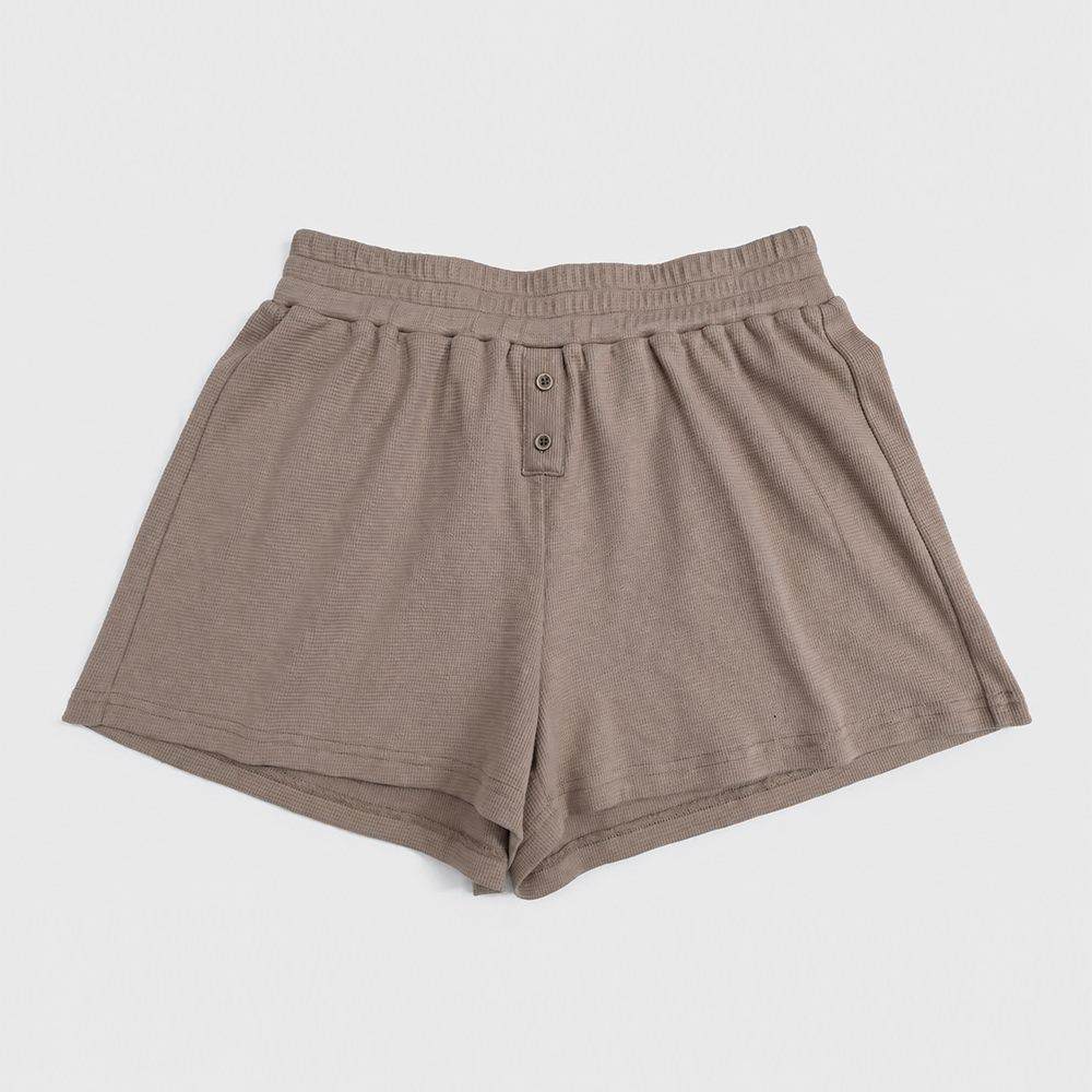 Elastic waistband and decorative front buttons on custom lounge shorts
