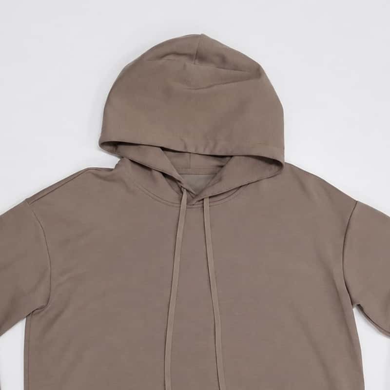 Drop-shoulder hood and matching drawstring detail on custom lounge top