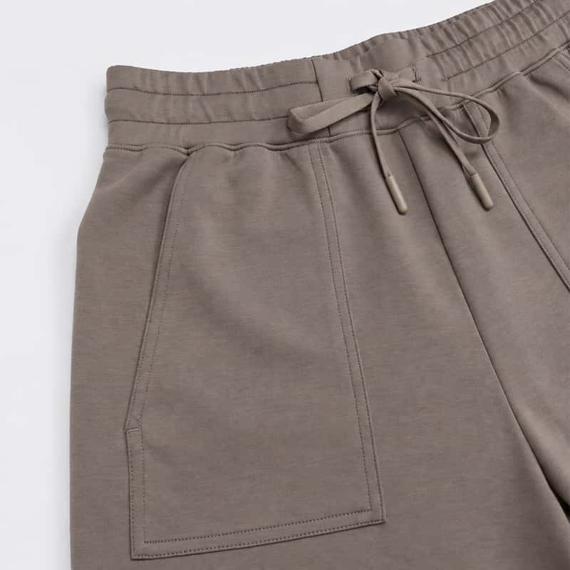 Large front patch pocket and drawstring waist detail on capri lounge pants