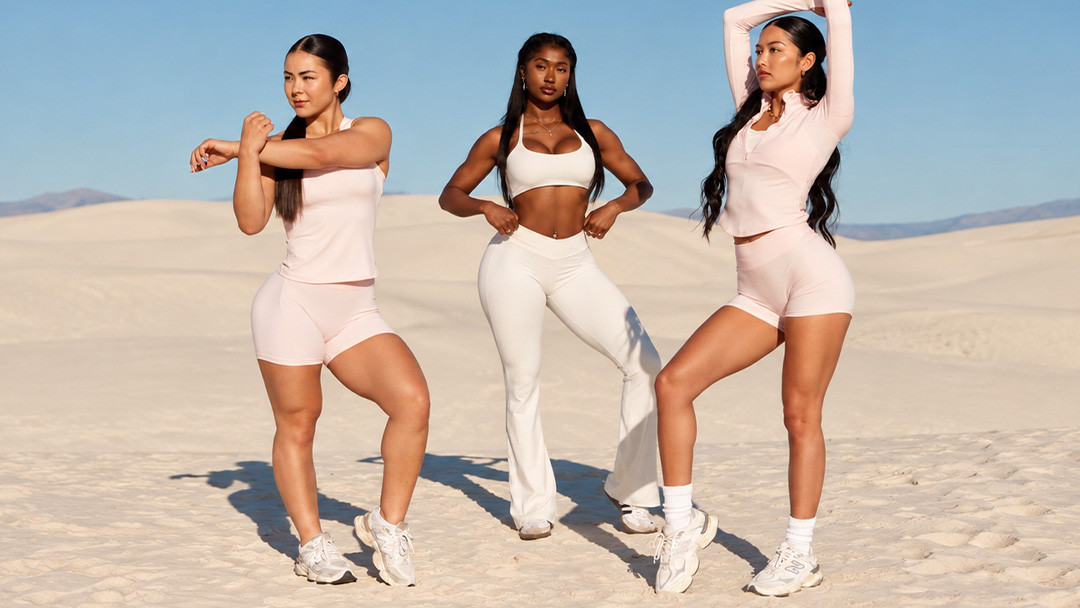 Women wearing fitted activewear during stretching and movement outdoors