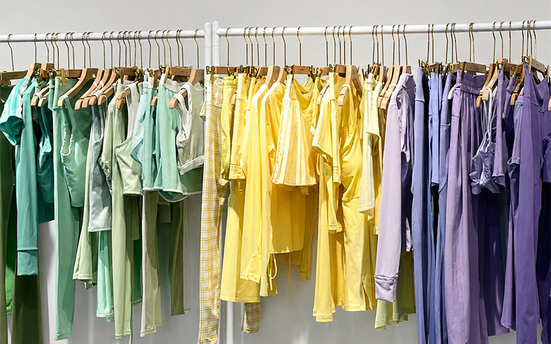 Colorful garments hanging on a clothing rack