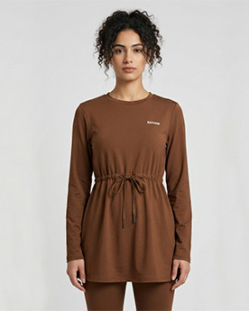 Long-sleeve top paired with relaxed activewear pants