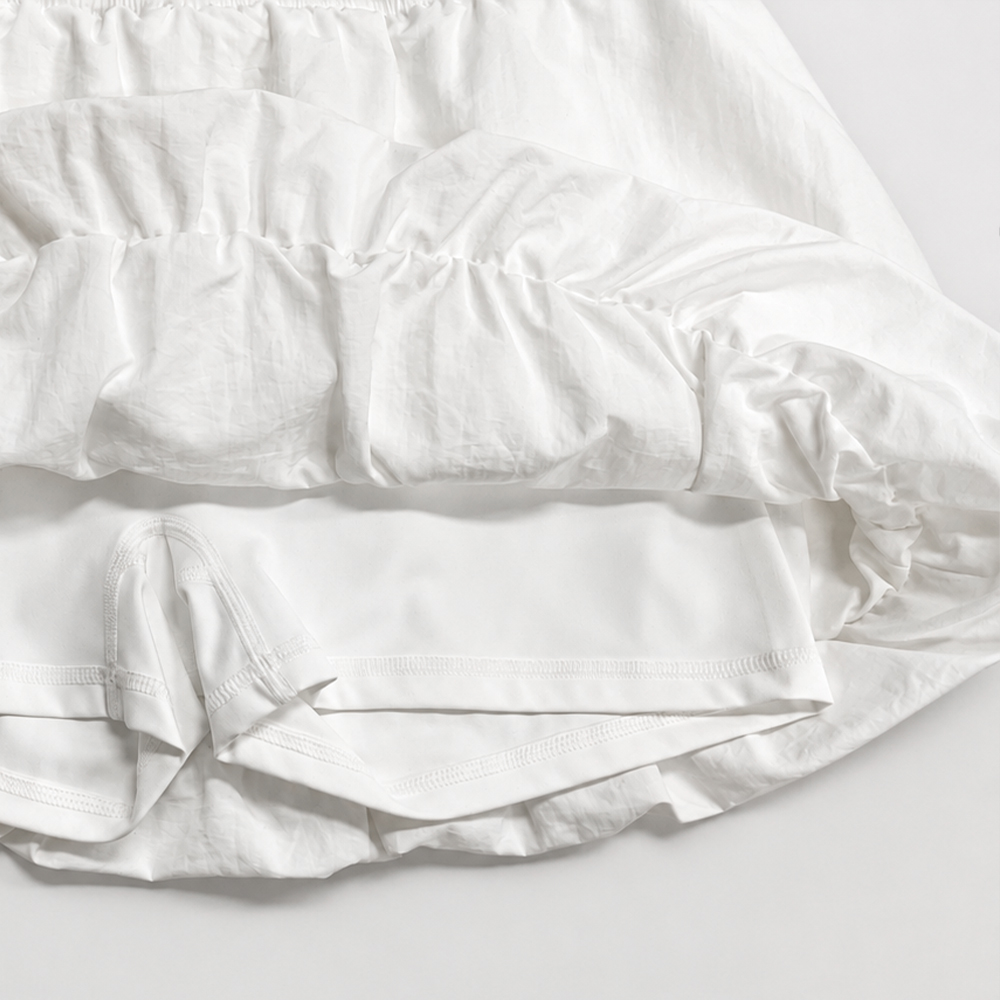 Inside view of the white bubble skirt showing its turned-in gathered hem and built-in shorts