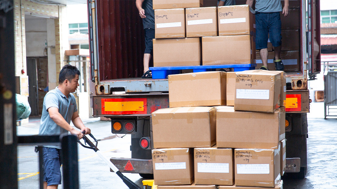 Cartons being loaded for activewear shipment after bulk production