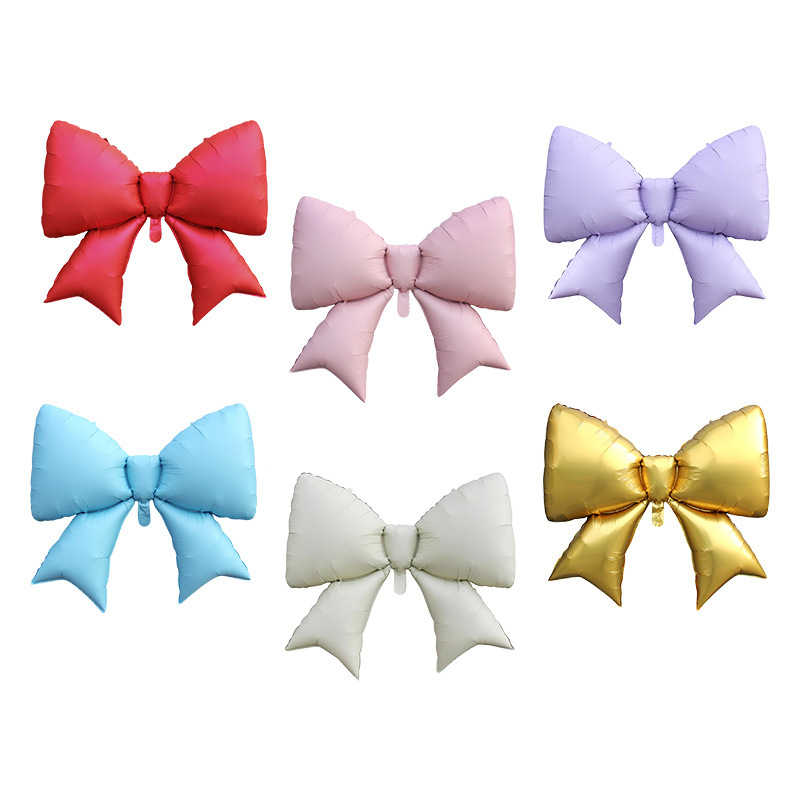 Bow-shaped foil balloons displayed in several colors