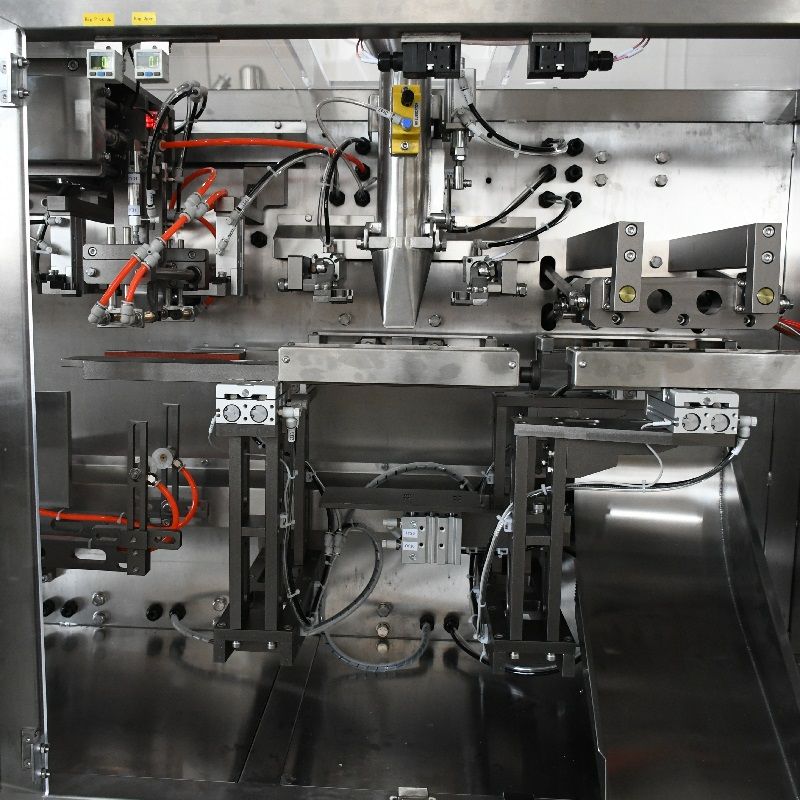 Pneumatic valve manifold and controls behind a protective guard on a packaging machine