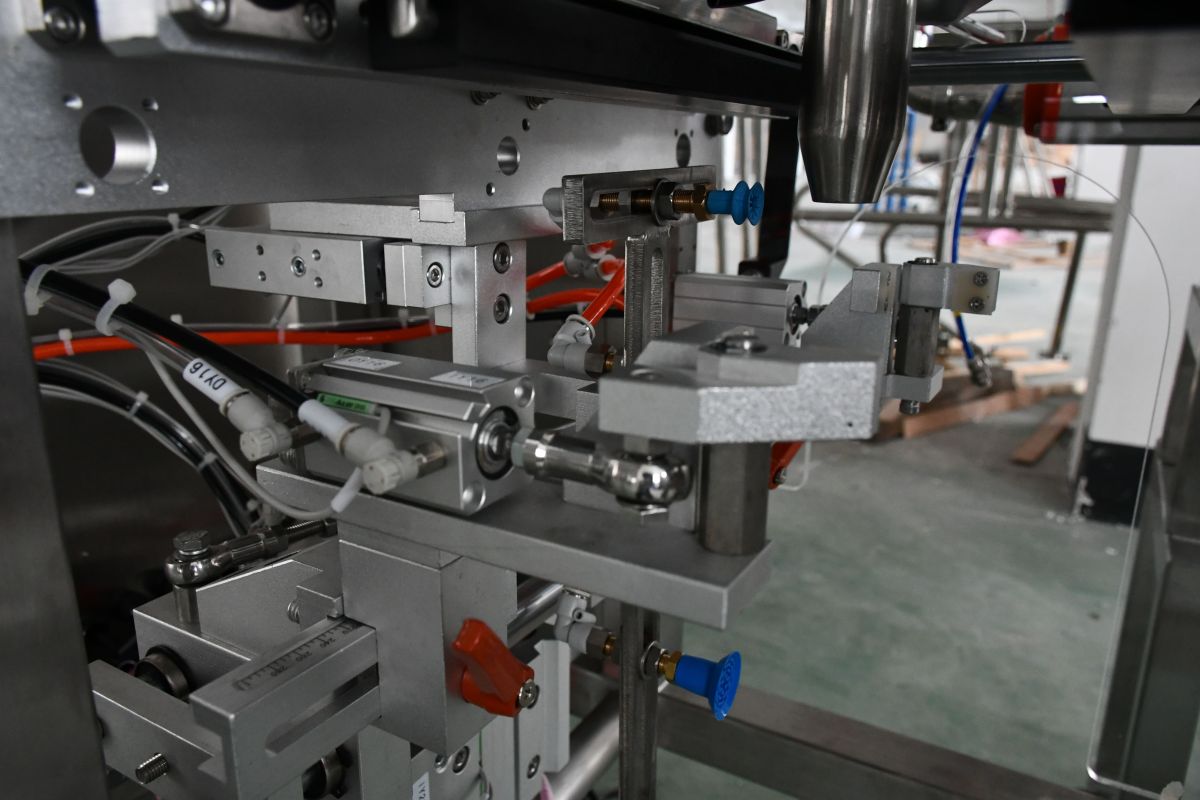 Close-up of welded and polished stainless steel surfaces on a food packaging machine
