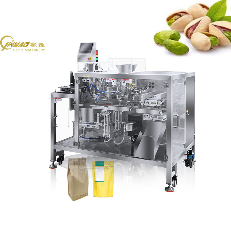 A multi-head weigher system for a nuts packing machine.