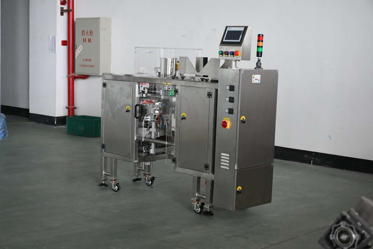 Stainless steel packaging machine with protective guard and control panel