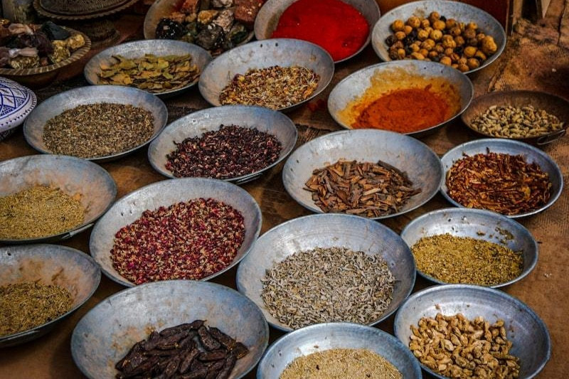 Assorted spices and seasonings in bowls ready for packaging