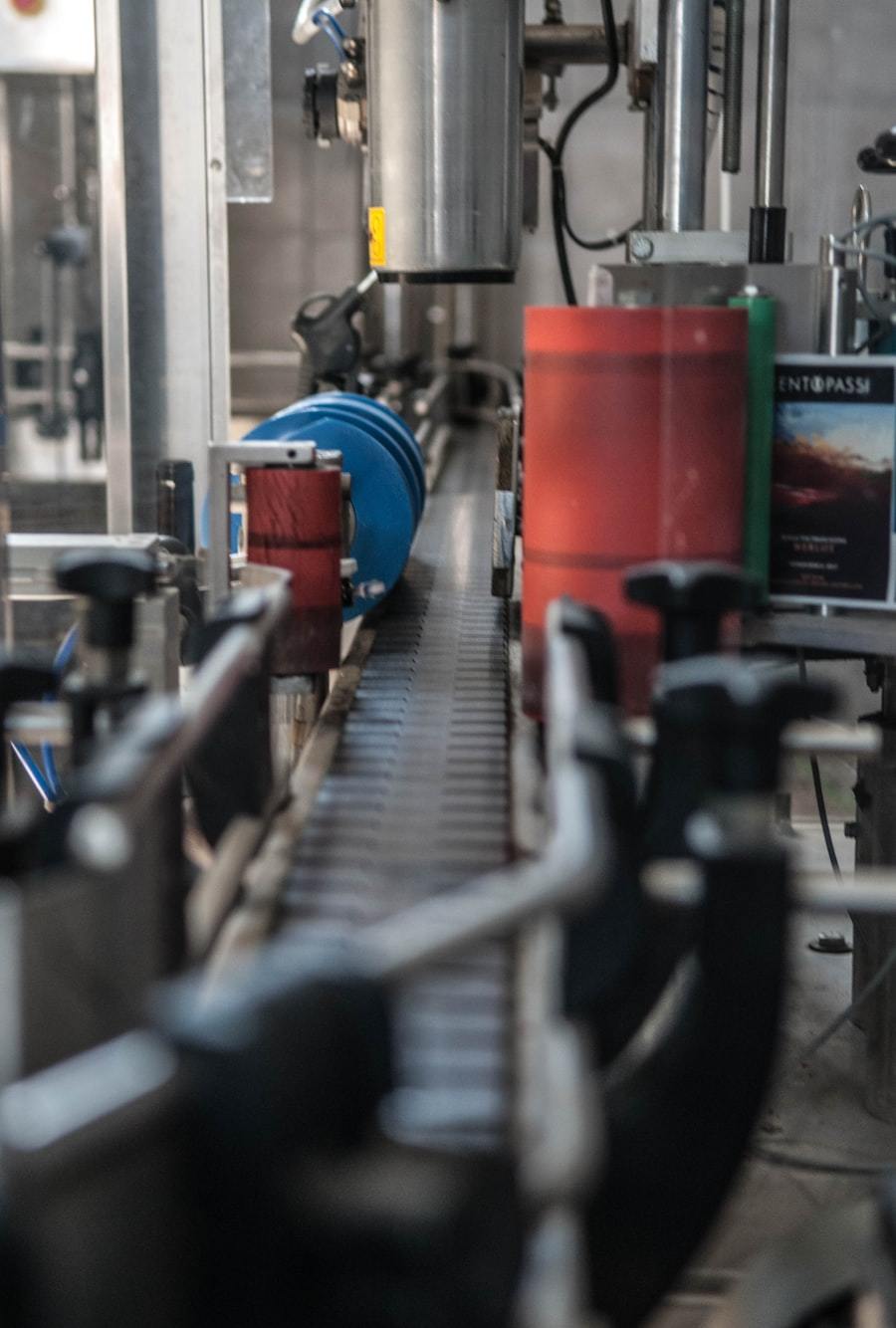 Line of industrial filling machines inside a factory