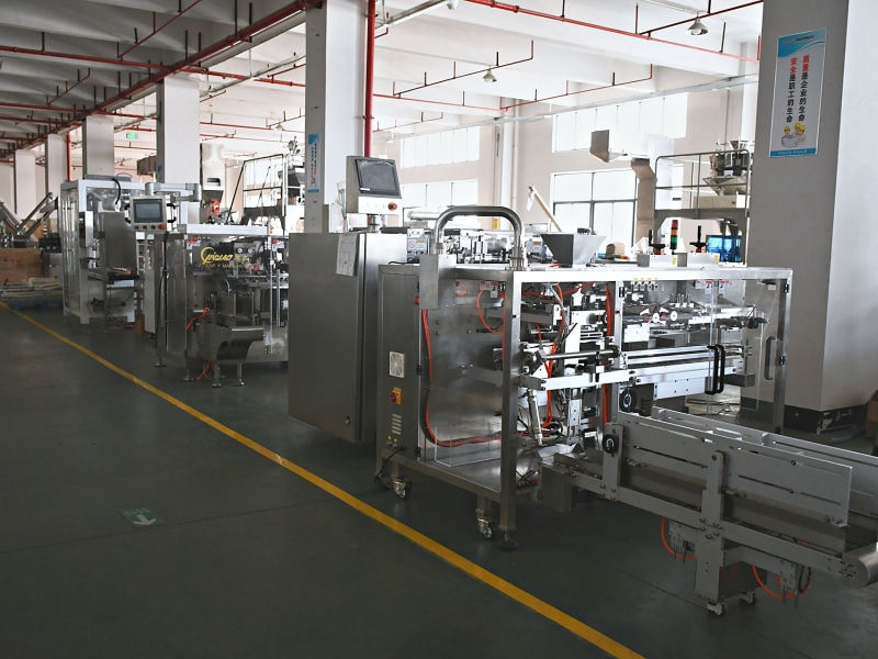 Several stainless steel packaging lines under test in the TOP Y assembly hall
