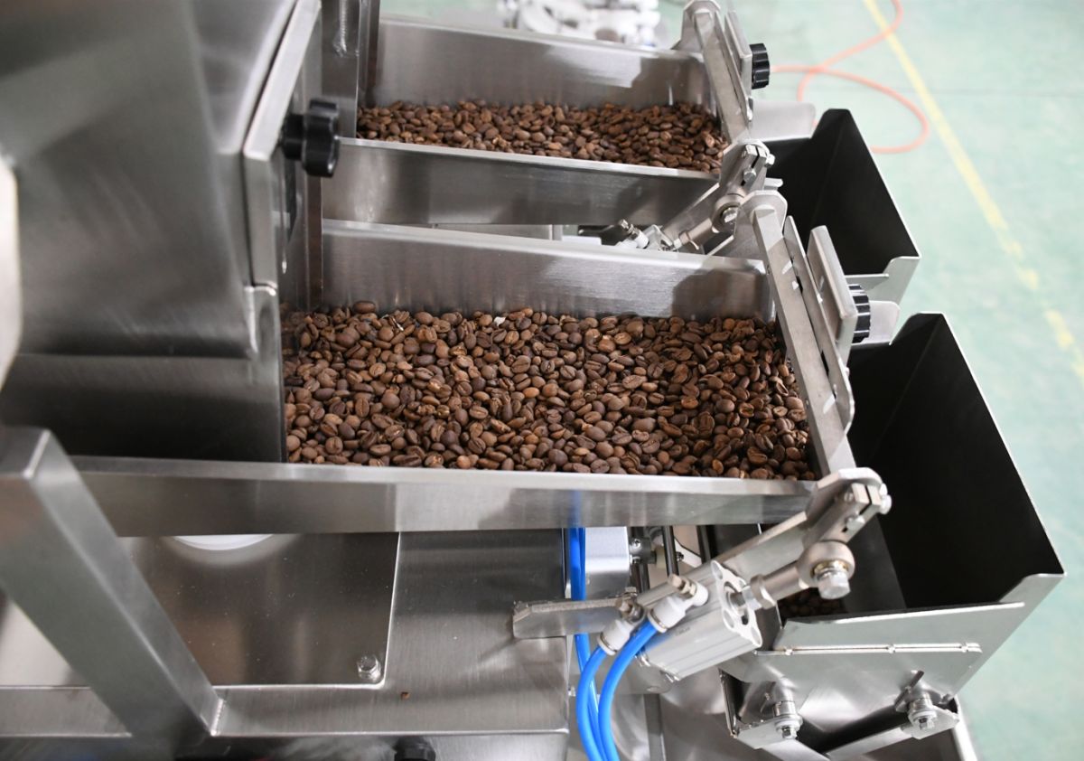 Product material flowing through the feed chute of a packaging machine