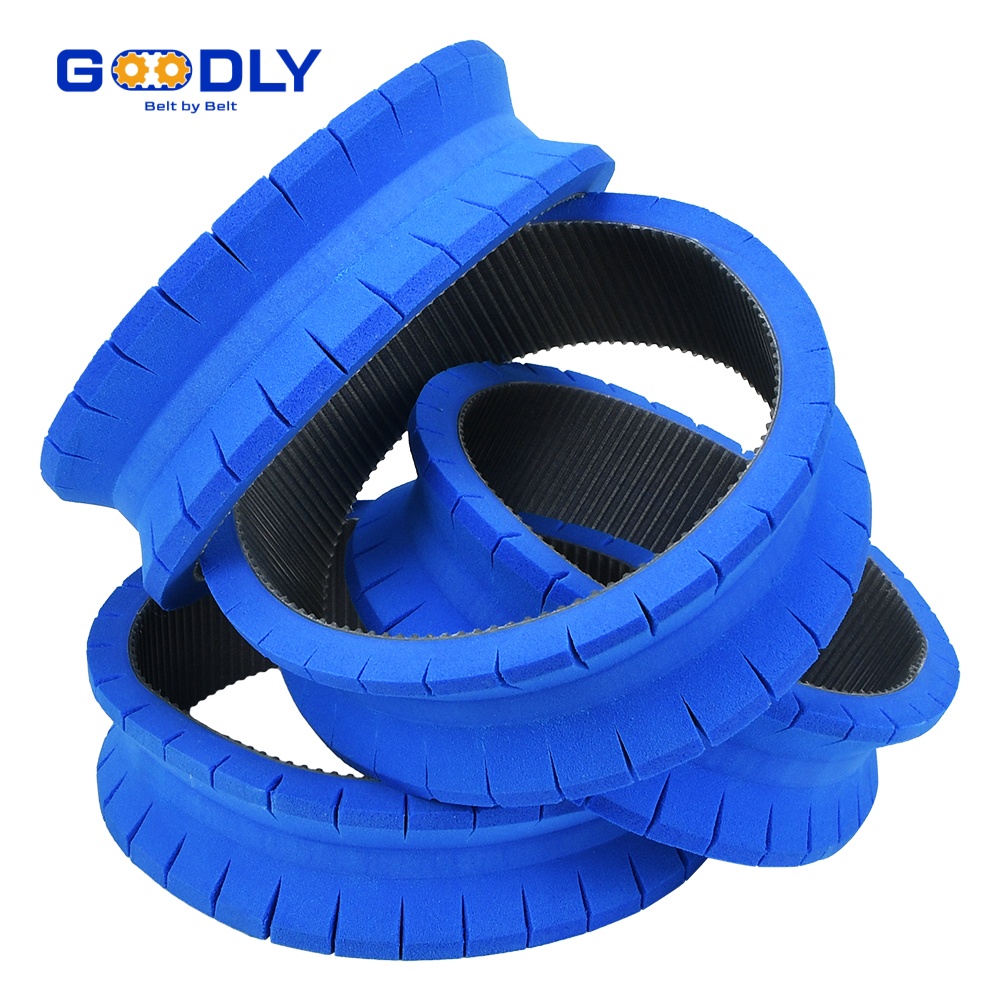 Blue coated timing belts with cleats used for pouch discharge on a VFFS line