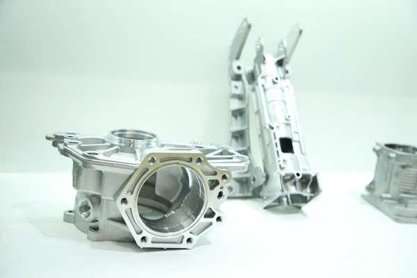 Metal mechanical parts on workbench for quality inspection