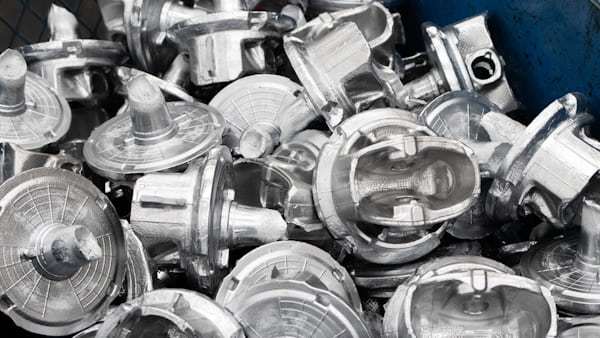Metal mechanical parts and pulleys in industrial workshop