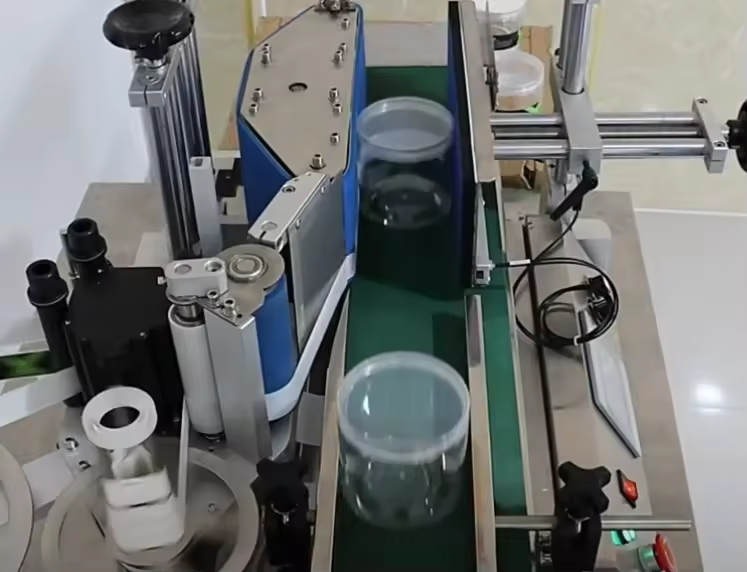 Timing belt conveyor carrying packaged goods along a packaging line